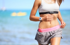 Bigstock-21109267-Runner-woman-with-heart-rate-monitor-running-on-beach-with-watch-and-sports-bra-top